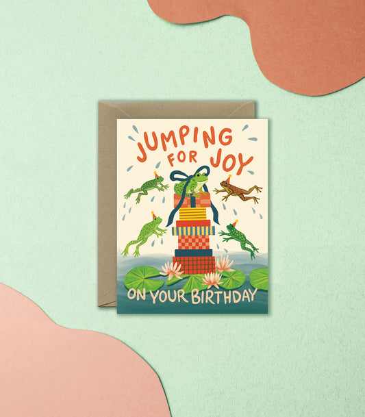 JUMPING FROGS AND GIFTS IN LILY POND - BIRTHDAY GREETING CARD