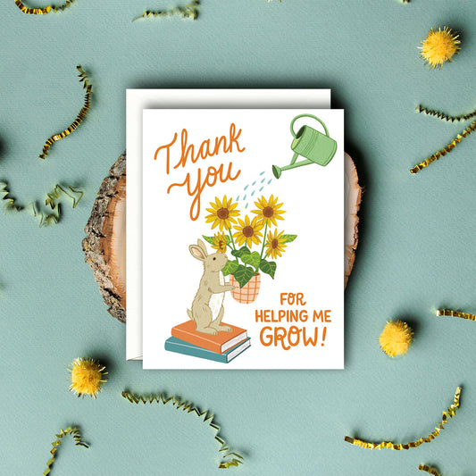 BUNNY HOLDING SUNFLOWERS - TEACHER APPRECIATION GREETING CARD